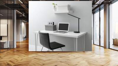 Stylish workplace with laptop and comfortable chair near white wall indoors. Interior design Wall mural