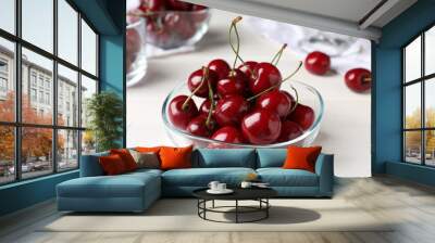 Sweet red cherries in bowl on white wooden table, closeup Wall mural