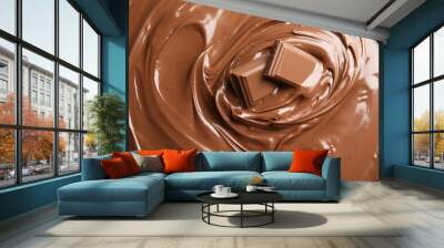 Sweet tasty chocolate cream with pieces as background, closeup Wall mural