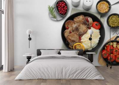 Tasty beef tongue pieces, berries, mashed potatoes and ingredients on white table, flat lay. Space for text Wall mural