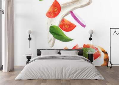 Tasty bruschetta with flying ingredients on white background Wall mural