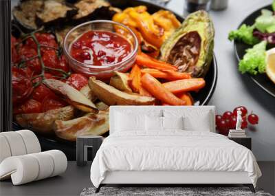 Tasty cooked vegetables served on grey table, closeup. Healthy meals from air fryer Wall mural