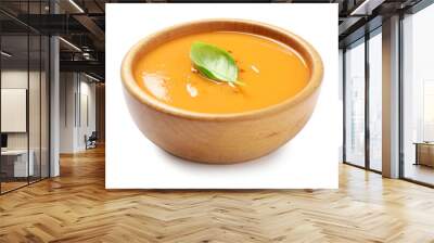 Tasty creamy pumpkin soup with basil in bowl on white background Wall mural