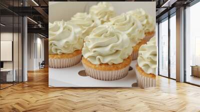 Tasty cupcakes with vanilla cream in box, closeup Wall mural