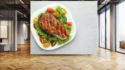 Tasty grilled salmon steak and vegetables on light grey table, top view. Space for text Wall mural