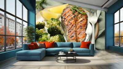 Tasty grilled salmon steak with broccoli served on table, closeup Wall mural