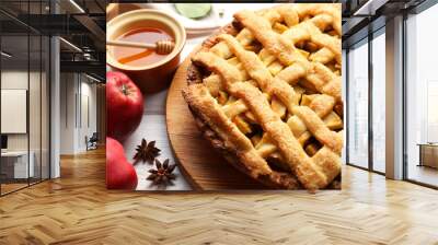 Tasty homemade apple pie and ingredients on white wooden table, closeup Wall mural