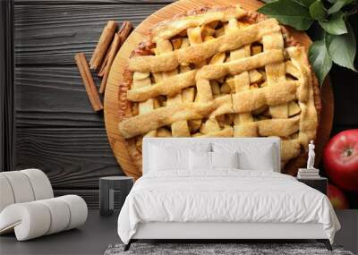 Tasty homemade apple pie and ingredients on wooden table, flat lay Wall mural