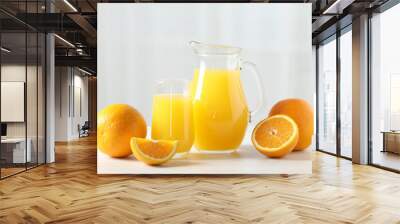 Tasty orange juice and fresh fruits on white wooden table Wall mural