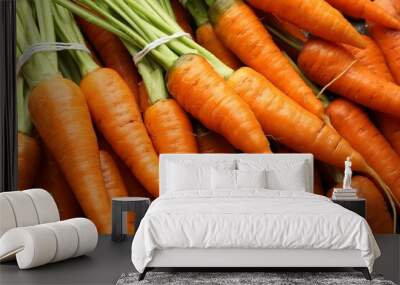 Tasty ripe juicy carrots as background, top view Wall mural