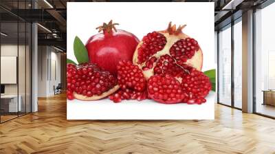 Tasty ripe pomegranates and leaves on white background Wall mural