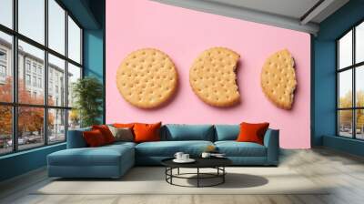 Tasty sandwich cookies on pink background, top view Wall mural