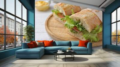 Tasty sandwiches with ham on white wooden table, closeup Wall mural