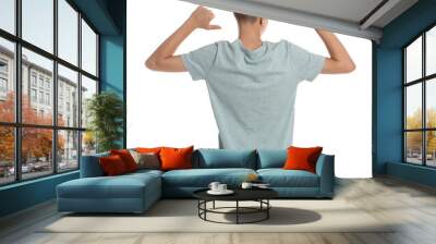 Teenage boy wearing light grey t-shirt on white background, back view Wall mural