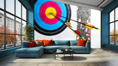 Three arrows in archery target, closeup view Wall mural