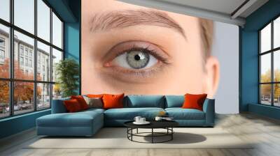 Tired young woman with dark circle under eye, closeup Wall mural