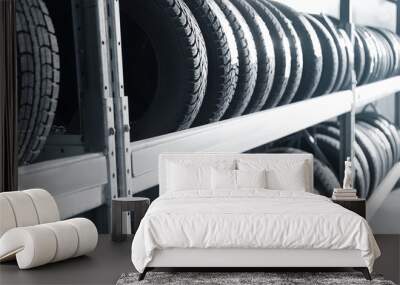 Tires on rack in car service workshop Wall mural