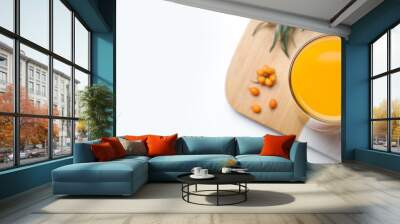 Top view of sea buckthorn juice on white table, space for text. Banner design Wall mural