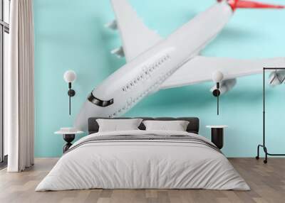 Toy airplane on light blue background, closeup Wall mural