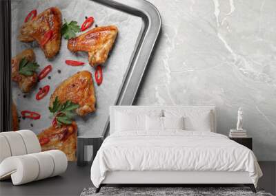 Tray with delicious fried chicken wings on light gray marble table, flat lay. Space for text Wall mural