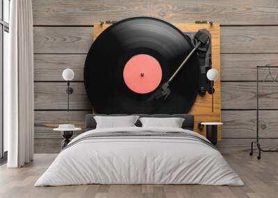 Turntable with vinyl record on grey wooden background, top view Wall mural