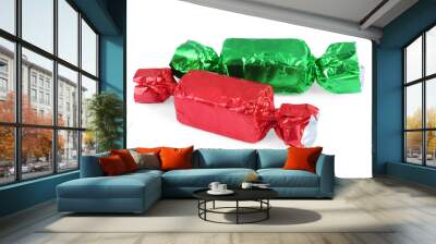 Two candies in colorful wrappers isolated on white Wall mural