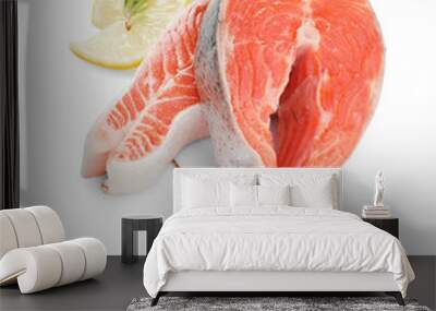 Two fresh salmon steaks, lemon and rosemary isolated on white Wall mural