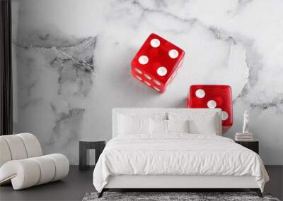 Two red game dices on white marble table, above view. Space for text Wall mural