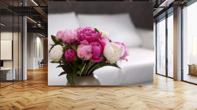 Vase with bouquet of beautiful peonies in room, space for text Wall mural