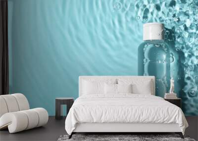 Wet bottle of micellar water on light blue background, top view. Space for text Wall mural