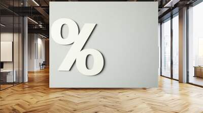 White percent sign on light grey background, top view. Space for text Wall mural