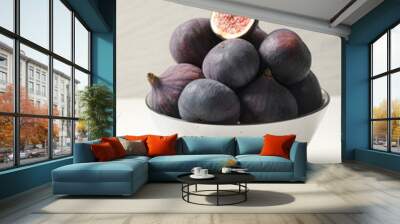 Whole and cut tasty fresh figs on white table Wall mural