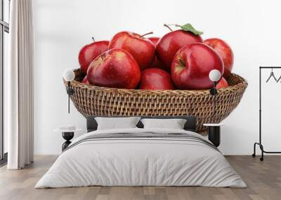 Wicker bowl of ripe juicy red apples with leaf on white background Wall mural