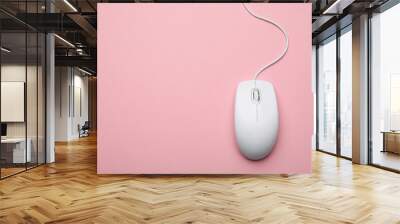 Wired computer mouse on pink background, top view. Space for text Wall mural