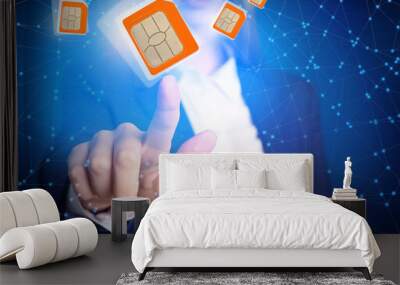 woman demonstrating sim cards of different sizes on color background, closeup Wall mural