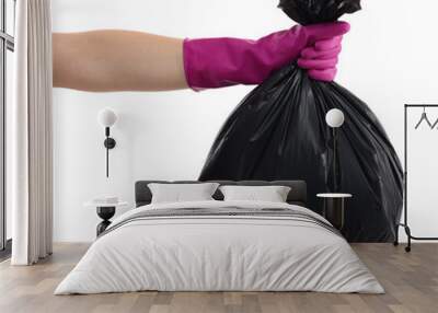 Woman holding plastic bag full of garbage on white background, closeup Wall mural