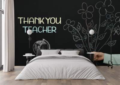 Woman near blackboard with drawn bouquet, globe and phrase Thank You Teacher, closeup Wall mural