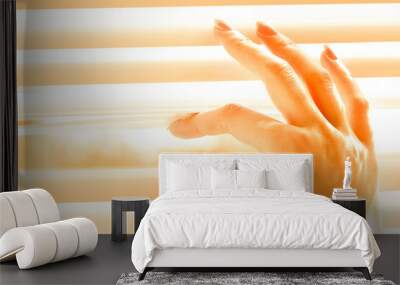 Woman separating slats of white blinds indoors, closeup Wall mural