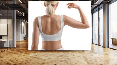 Woman showing her sporty body on white background, back view Wall mural