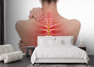 Woman suffering from pain in back on white background Wall mural