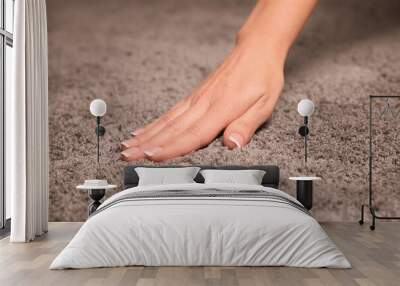 Woman touching soft grey carpet fabric, closeup Wall mural