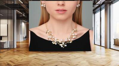 Woman with elegant jewelry on gray background, closeup Wall mural