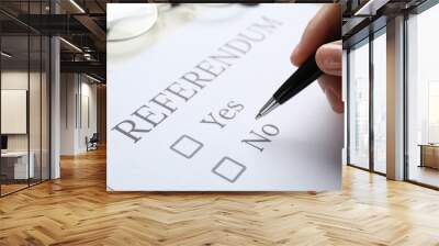 Woman with referendum ballot making decision at white table, closeup Wall mural