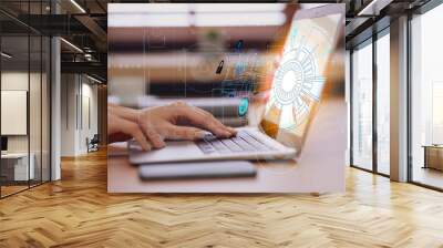 Woman working with laptop at table, closeup. Modern technology concept Wall mural