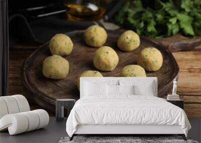 Wooden board with raw falafel balls on table Wall mural