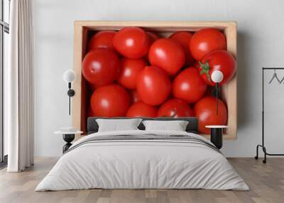 Wooden crate full of fresh delicious tomatoes on table, top view Wall mural