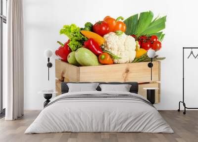 Wooden crate with fresh vegetables on white background Wall mural