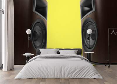 Wooden sound speakers on yellow background, closeup. Space for text Wall mural