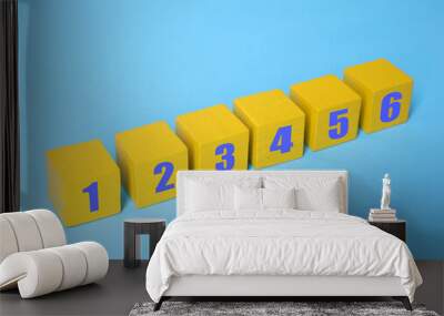 Yellow numbered cubes on light blue background. Step-by-step concept Wall mural