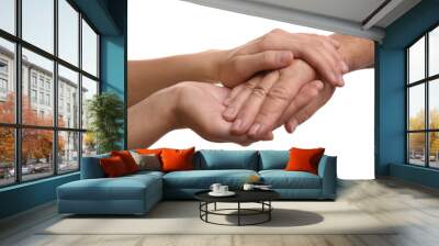 Young and elderly women holding hands together on white background, closeup Wall mural